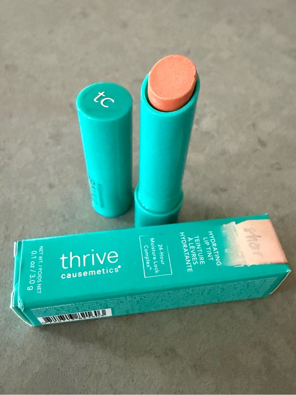 thrive causemetics Sheer Strength Hydrating Lip Tint in Amy Peach Pink Shimmer